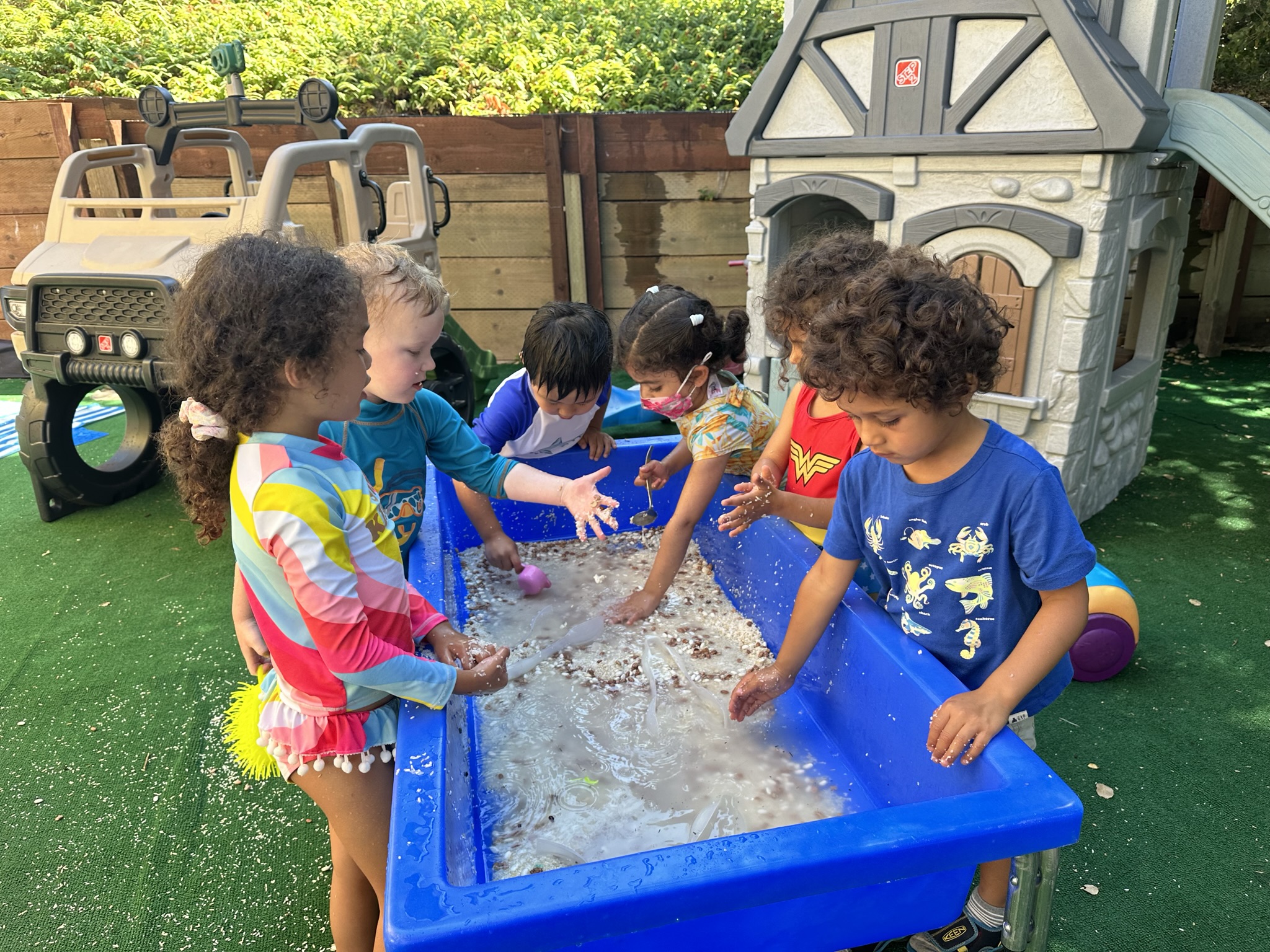 Outdoor water sensory play at Butterflies Academy summer camp